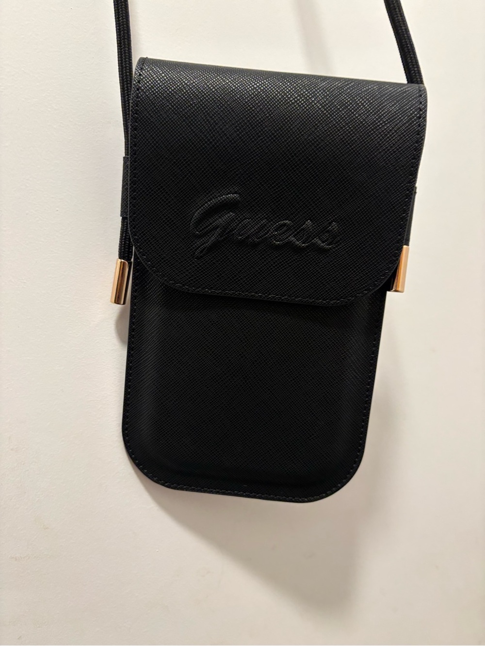 Guess Black Crossbody Phone Pouch with Gold Accents adjustable too…